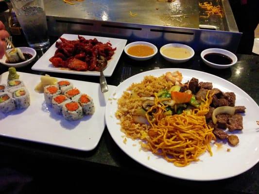 At the hibachi table, with pork spare ribs, spicy tuna roll, salmon avocado roll, and NY strip hibachi entree.