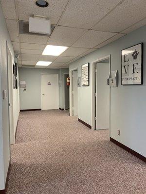 View of our hallway directing you to our treatment rooms