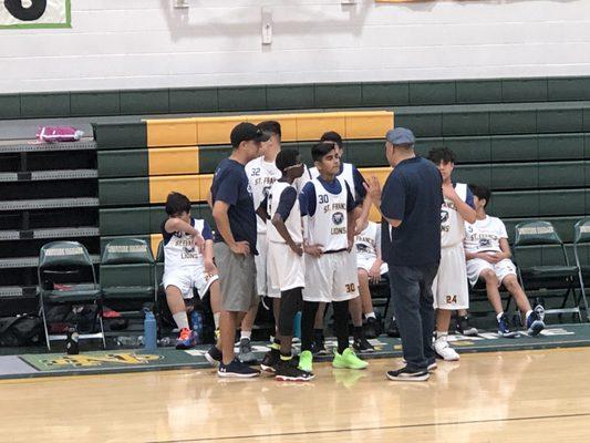 A team's basketball team huddle.