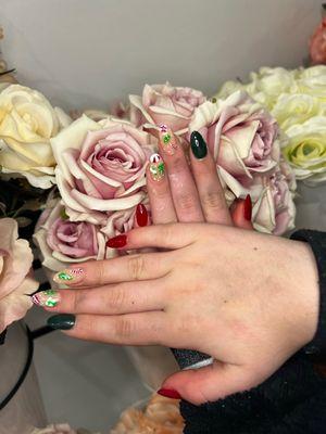 My daughter's Christmas themed nails that with designs that are a piece of art!