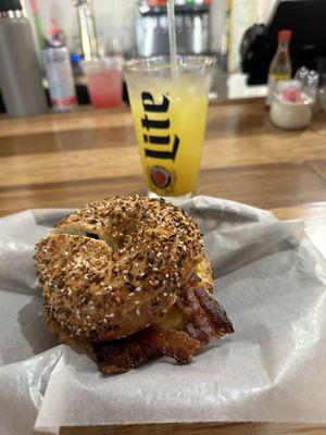 Everything bagel breakfast sandwich and orange crush