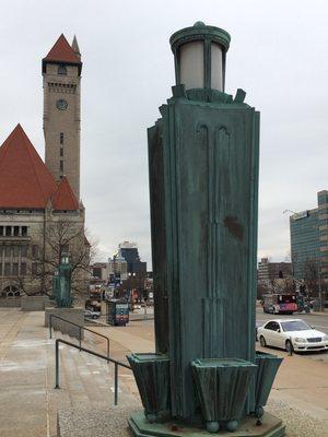 An exterior lamp stand with Union Station in the background.