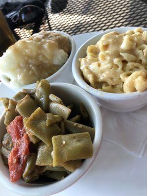 Mashed potatoes and gravy, Italian green beans and Mac & cheese .