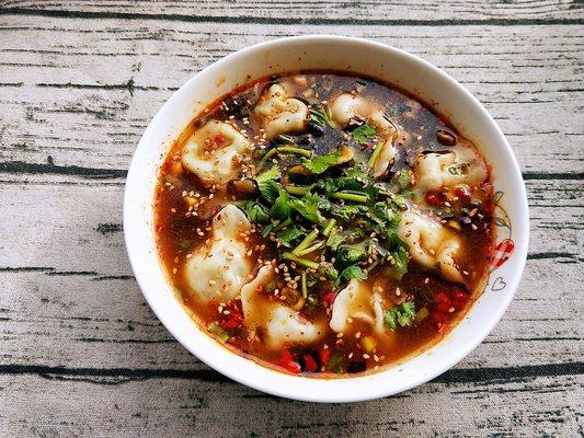 Soup dumplings with House special sauce and Cllantro