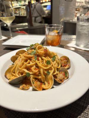 Pasta with clams in a spicy red sauce