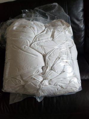 My Goose down comforters folded poorly and shoved in a plastic bag