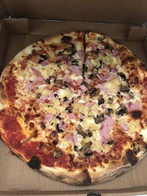 Large ham, mushroom and pineapple pizza.