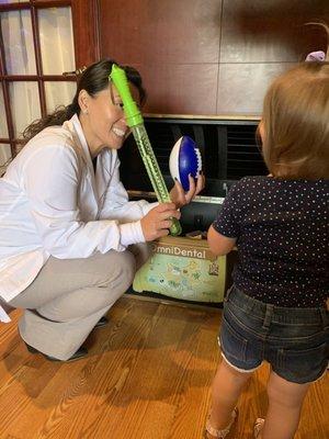 Our daughter picking out a toy from the chest after her first appointment