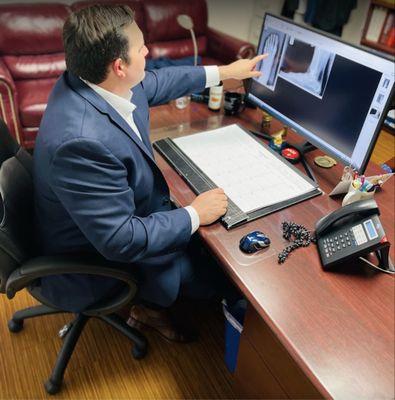 Dr. Haddad at his desk 2