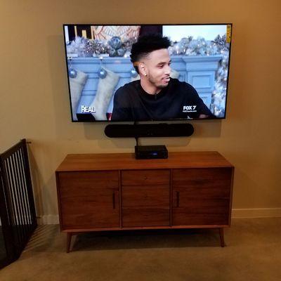 Standard 65" LED and Soundbar mounting without in-wall wiring upgrade.