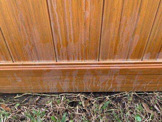 damaged vinyl fence - right behind my outdoor faucet and hose - from paint brush shaking and splatter