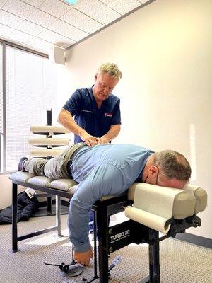 Dr. Smedstad giving his patient a Chiropratic adjustment!