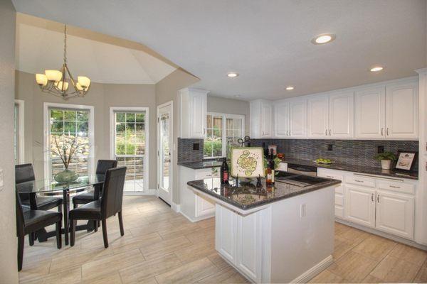 Roseville, CA.  Painted cabinets, granite counters, tile backsplash, LED lighting, tile floors