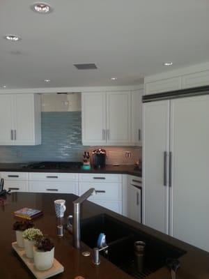 Remodeled kitchen with an island sink in a high rise.