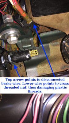 Brake light switch detached and mounting nuts cross-threaded