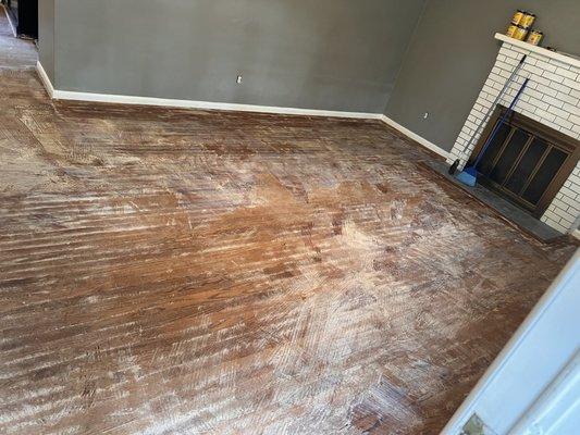 This is What the floors looked like before we started Sanding and refinished with country white stain