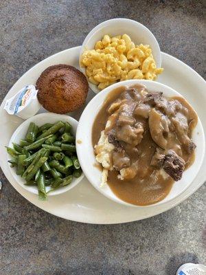 Beef tips over mashed potatoes