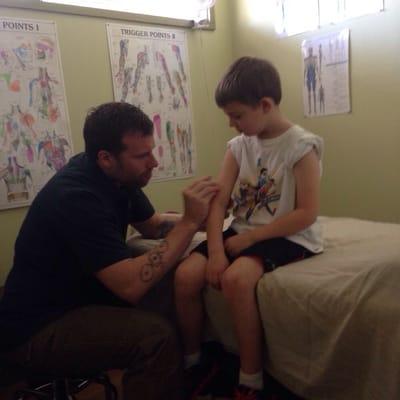 James giving Travis (age 7) acupuncture