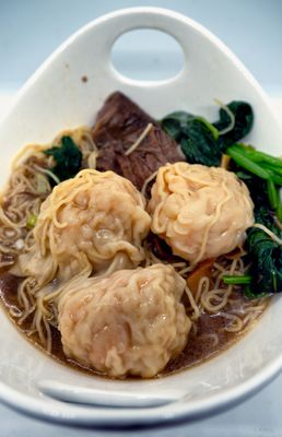 Two Topping Noodles, with Wontons and Beef Brisket, and thin egg noodles. Take-out.