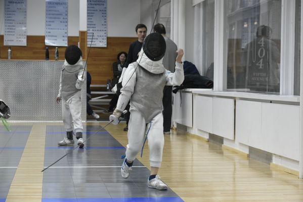 Fencing foil class. Kid zone.