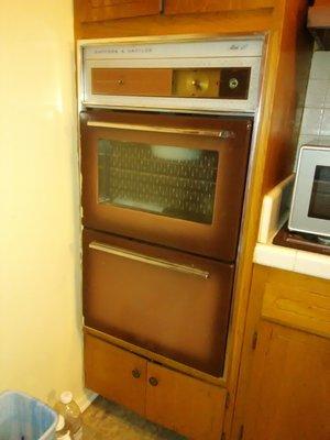 The oven we JUST got changed, aren't they supposed to upgrade or do something yearly at ALL? mold behind it, its gone. 60's.