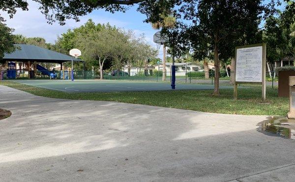 Smaller kids area to the left, basketball court and then on the right a bigger kids playground.