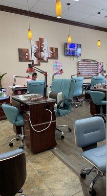 Nail stations and another rack of gel polish.