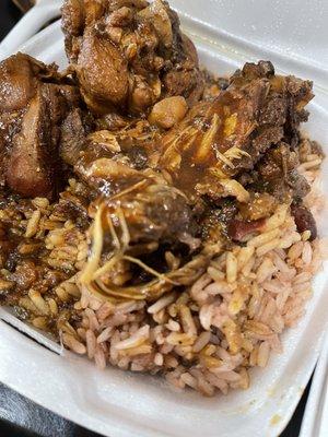 Brown stew chicken & rice and peas