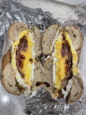 Bacon egg cheese and cream cheese on cinnamon raisin bagel