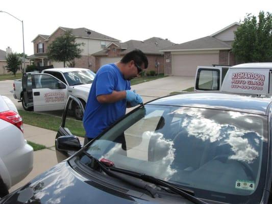 Technician working on customer car