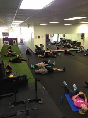 Stretching after a high energy training session at FitTRAC World HQ