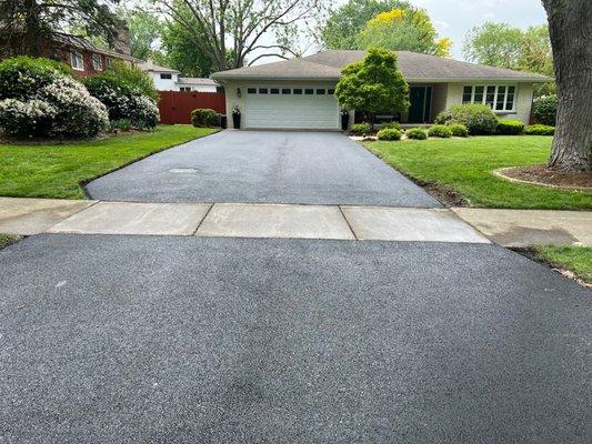 After (they also backfilled with soil and grass seed along the sides of the driveway)