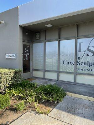 The front door of Luxe Sculpt Spa, view from the walk up.