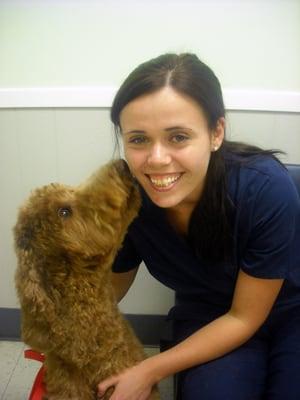 Animal Care Specialist Samantha with a canine friend