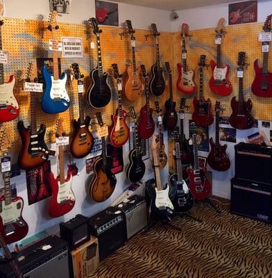 Our main wall of used and vintage guitars. We also have walls of acoustic and nice beginner guitars.