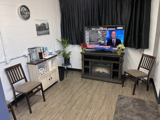 Our newly remodeled waiting area , free coffee and water , tv , nice warm fireplace