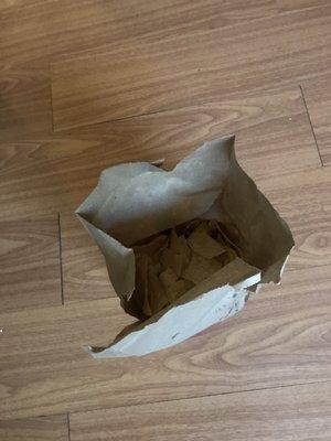 Chips received with a cup of cheese sauce...less than half of a small brown paper bag