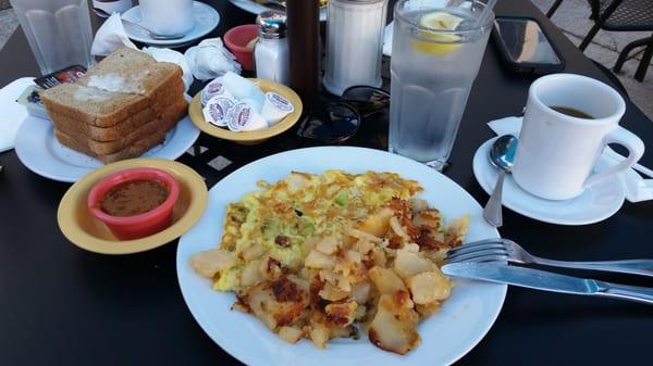 Turkey, Avocado & Cheddar Omelette w/ home fries. Sauce on the left is their homemade hot sauce (YUM) w/ wheat toast & coffee.