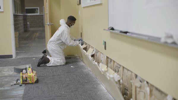 SERVPRO taking out drywall after a flood.