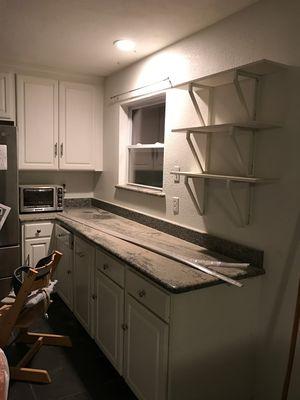 The condition our kitchen was left in after the first day of tear down because they didn't tape it off.