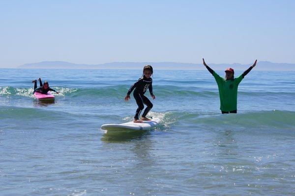 Learning to catch their own waves in surf class