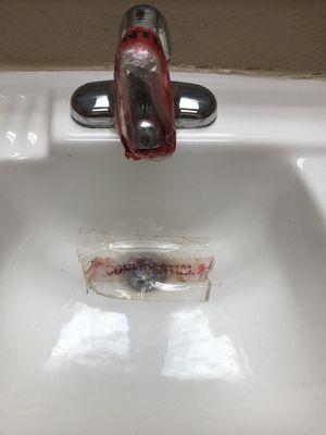 Sink is taped tight so you can't use it or pour anything down the sink.