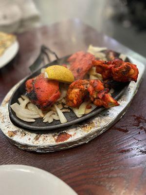 Tandoori Chicken \\ 4 pieces for $9.95 \\ comes out on sizzling fajitas plate