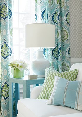 We love these fresh restful colors coordinated between draperies and custom pillow accents from our workroom.