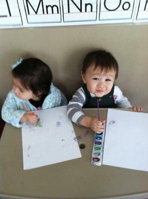 Painting session at Susan's Daycare.  Even very young children learn to paint and have fun!