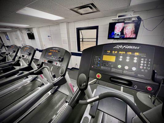 The cardio room has bikes and treadmills.