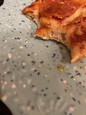 Pizza with hair (hanging off lower bite)