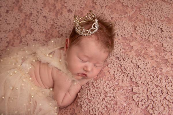 newborn girl with crown