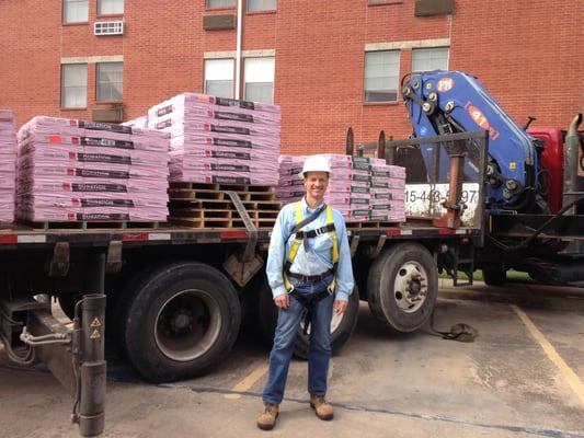 For Texas clients, Momentum Bay's consulting brains become green building brawn, in this case, roofing contractors installing a "cool roof."