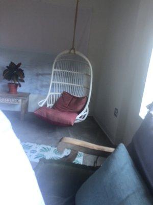 Hanging chair in mediation room